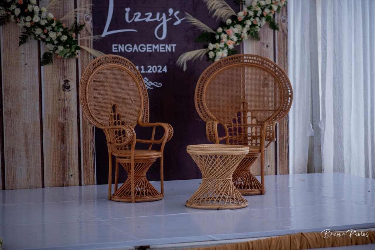 An engagement stage with two rattan chairs
